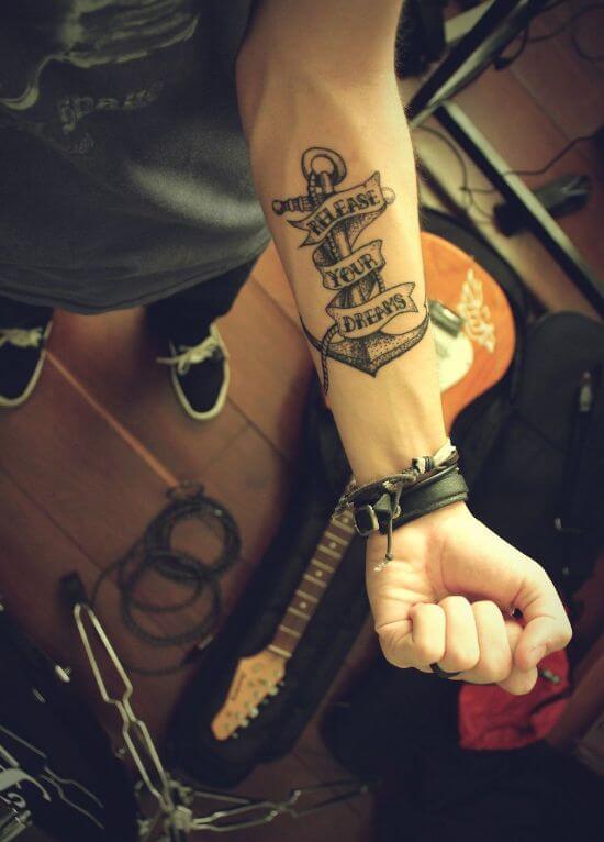 Anchor tattoo boys with quote on forearm