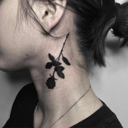 Black Rose Tattoo behind the ear