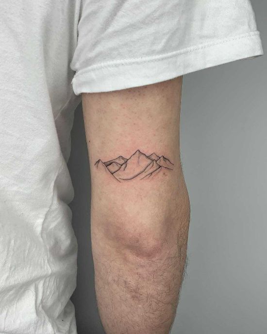 Minimalist mountains tattoo