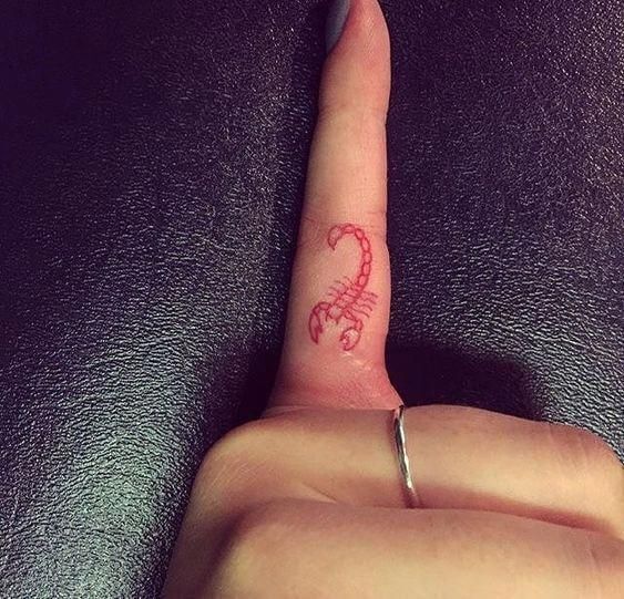 Tiny Red Scorpion finger tattoo designs