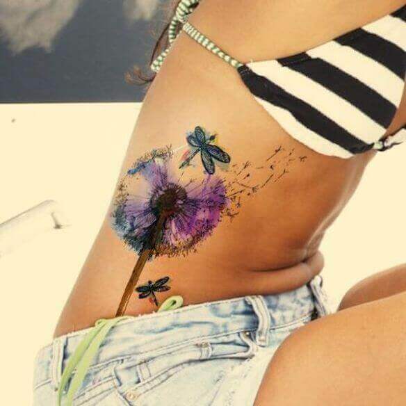 Girl Rib cage dragonflies tattoo