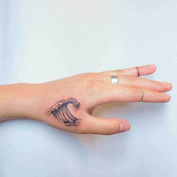 Hand waves tattoo