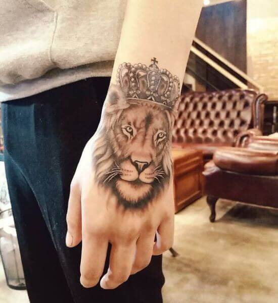 Latest Lion with Crown Tattoo designs on Hand