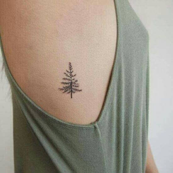 Small Tree tattoos on women rib cage