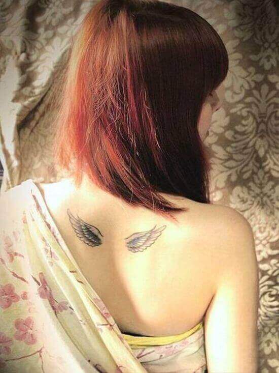 Beautiful Small Angel Winged tattoo designs on girl's Back