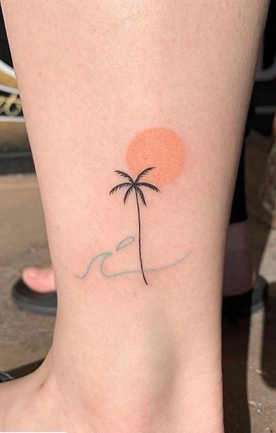 Beautiful palm tree tattoos on Leg