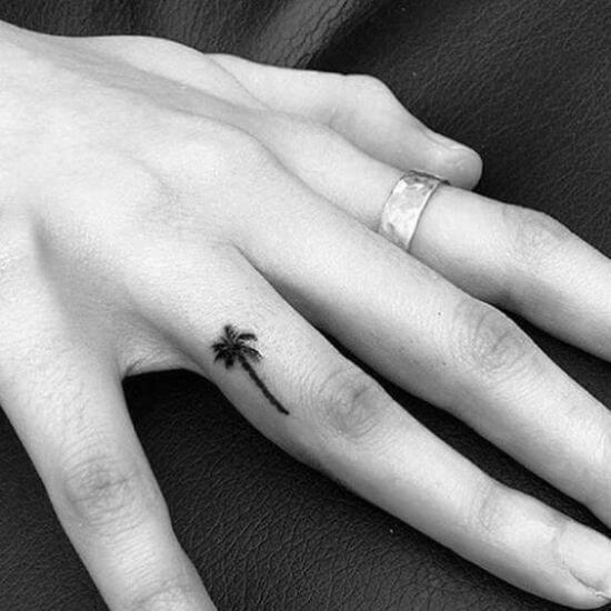 Black Inked Tiny Palm tattoo on Finger