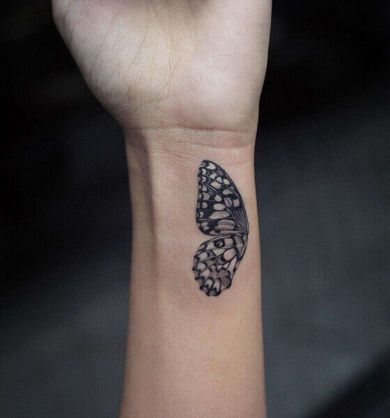 Half butterfly tattoo on wrist