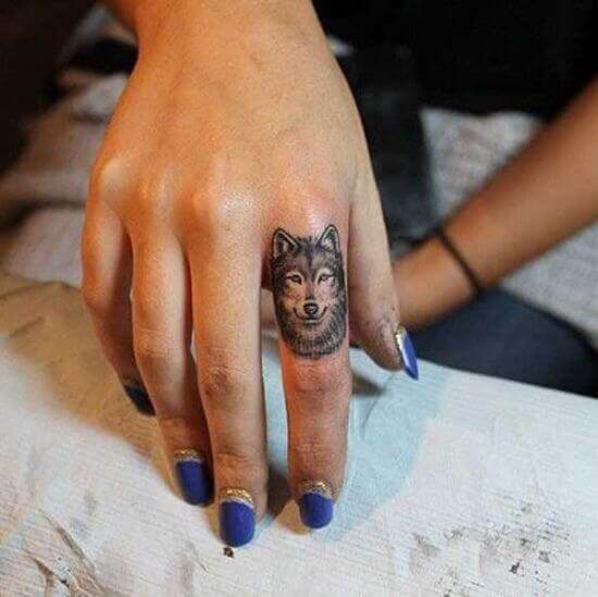 Miniature Wolf Tattoo Designs on Finger
