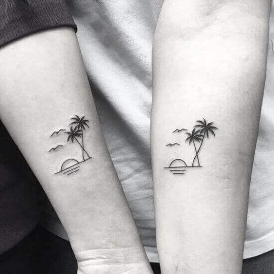 Palm tree tattoo with sea and sun