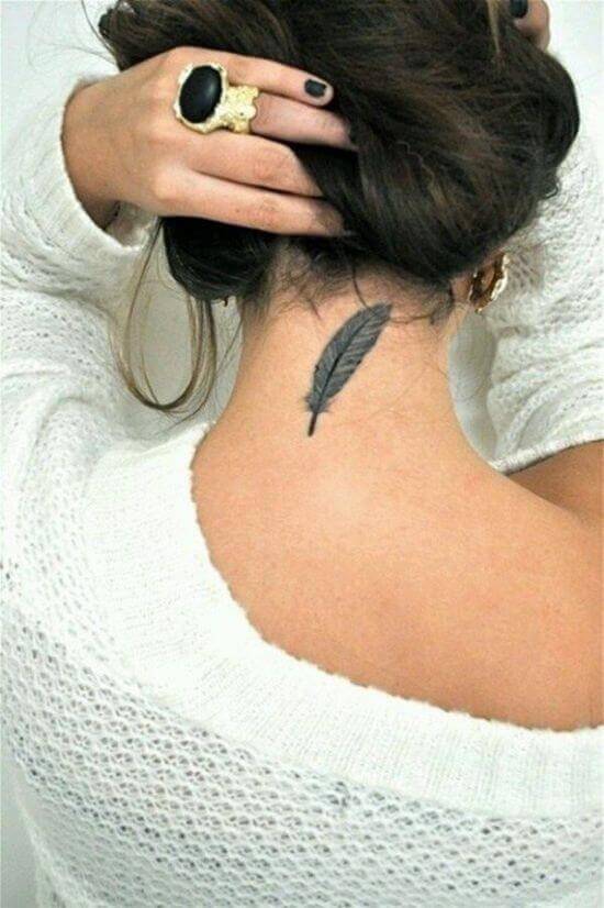 Small and Simple Feather tattooed on girl's nape