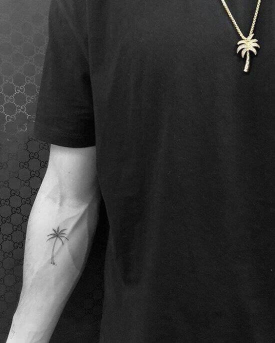 Small palm tree tattoo designs on arm