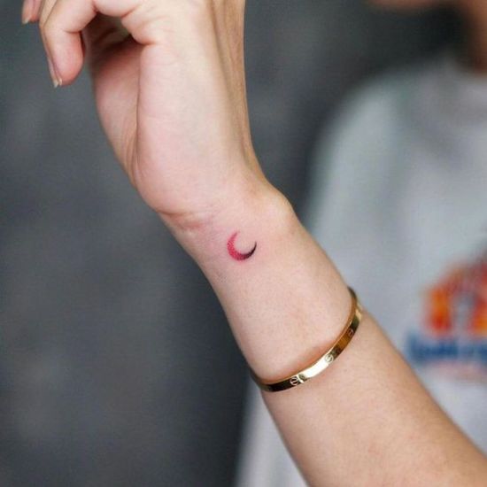 Crescent moon tattoo on hand