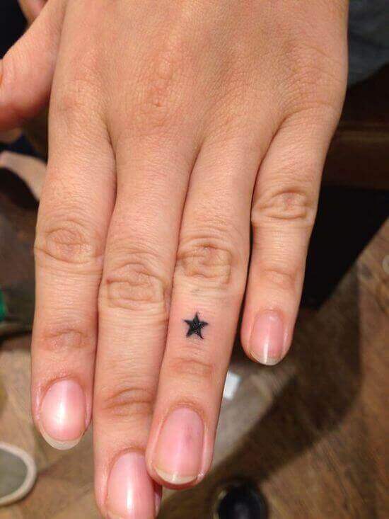 Simple Tiny Stars ink on finger
