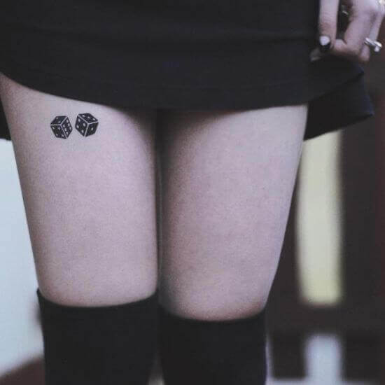 Small Dice Tattoo on girls thigh