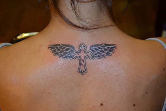 Pointed Ends Cross Tattoo with Wings on Back