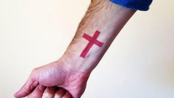 Small Red Cross Tattoo on wrist 19