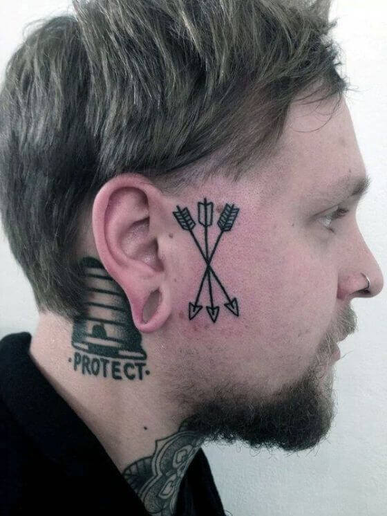 Arrow tattoo design on face