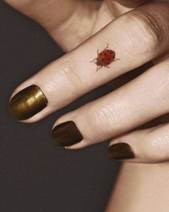 Bug tattoo on finger