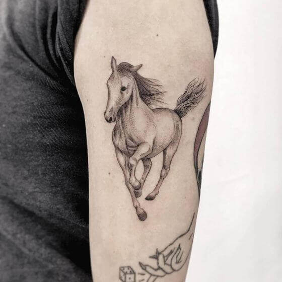 Horse tattoo on arm