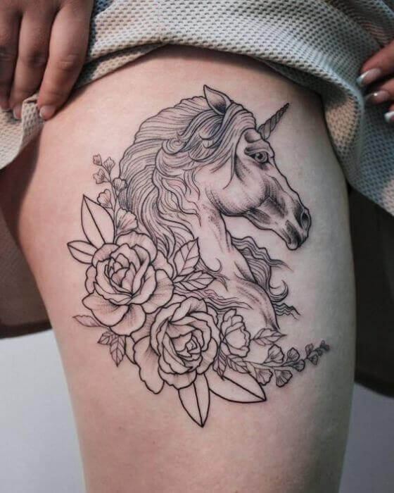 Unicorn tattoo on thigh