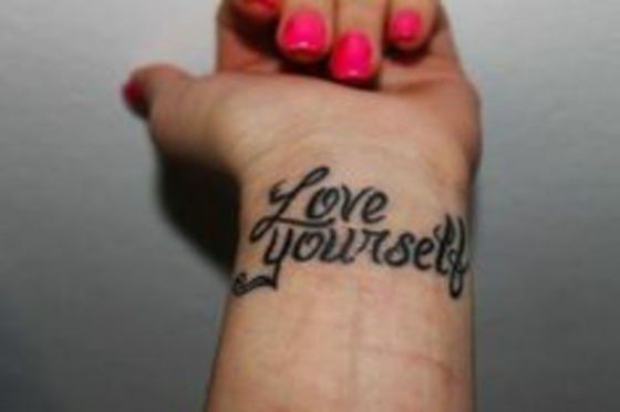 Wrist quote tattoo