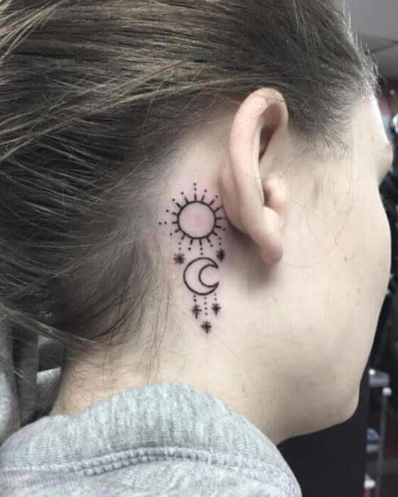 Small sun and moon tattoo designs on ear