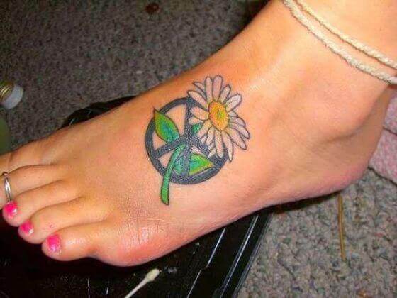 peace sighn with flower tattoo on foot