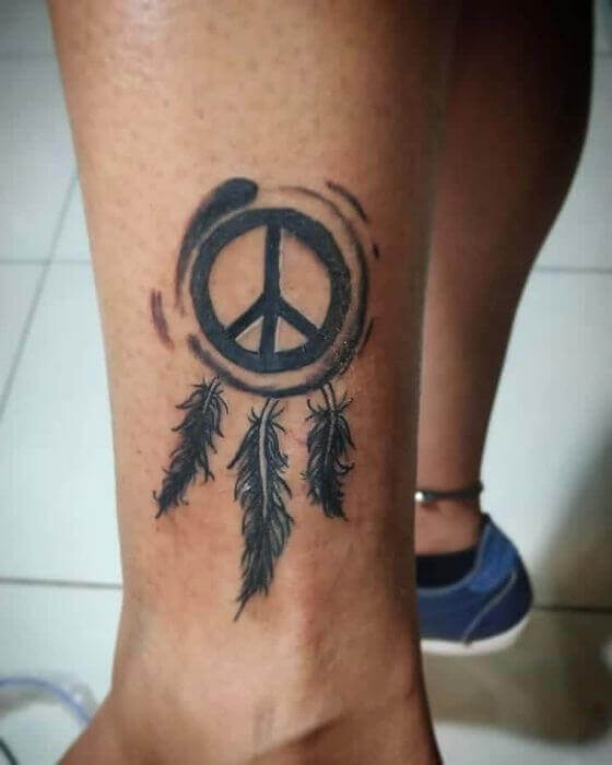 peace sign with dreamcatcher tattoo