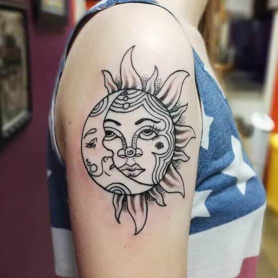 sun and moon art on shoulder