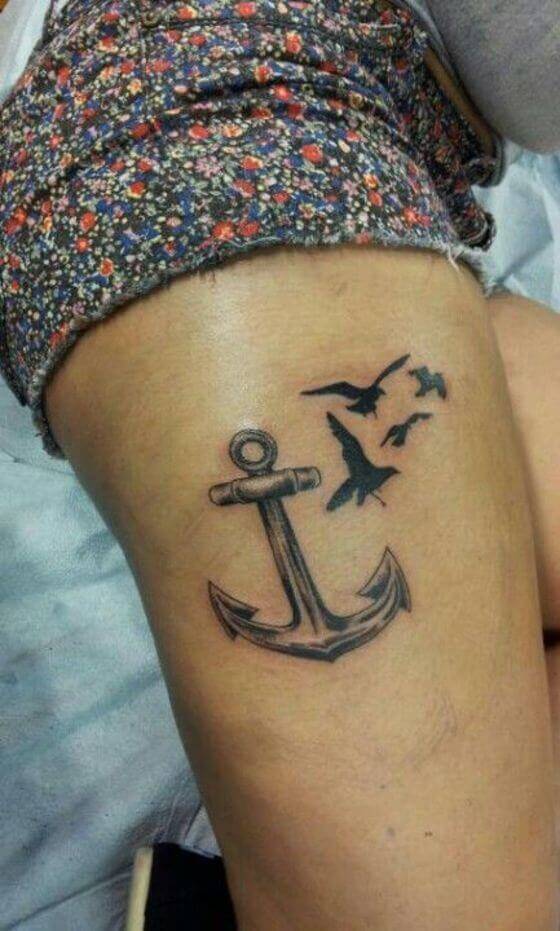 Anchor with Bird Tattoo designs on Girl thigh 3