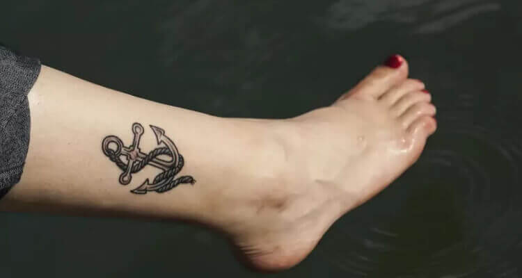 Tiny Anchor Tattoo On Foot