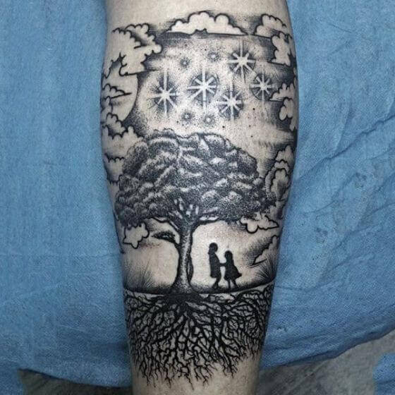 mens-forearms-kids-playing-under-tree-family-tattoo