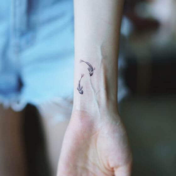 Cute Tiny Fish art on women Hand