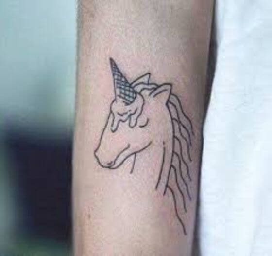 Funny Unicorn tattoo on arm