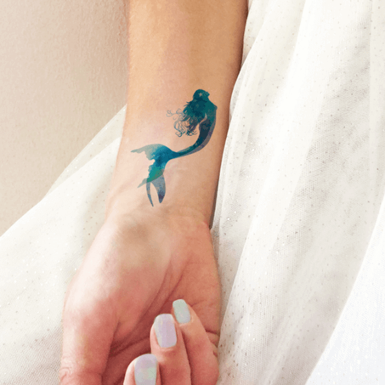 Simple-Fish-Tattoo-designs-on-girl-Wrist