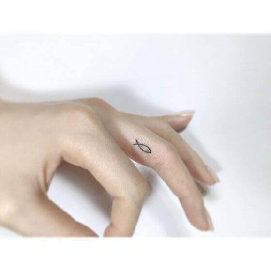 Tiny Fish on tattoo on finger