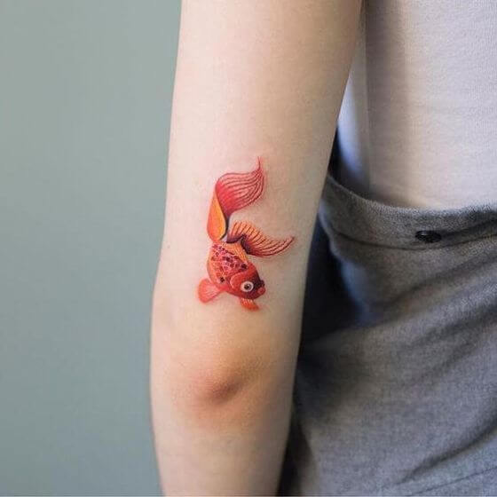 Yellow Goldfish Tattoo designs for men and women