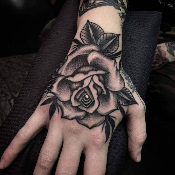 hand black and white rose tattoo