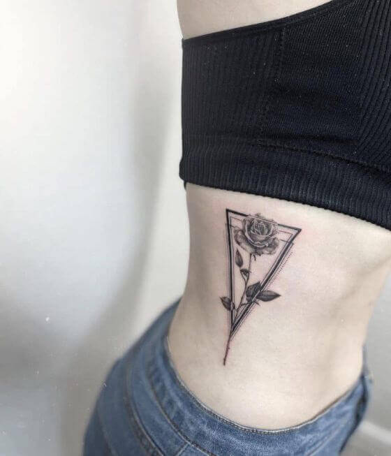 side rose with stem tattoo women