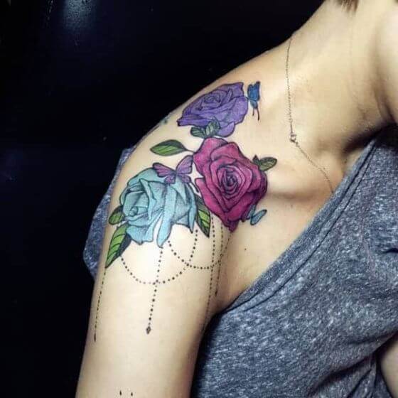 Rich Roses tatoo on girl shoulder