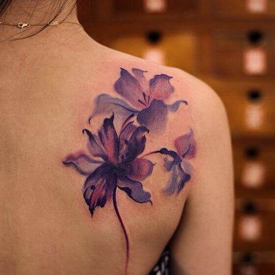 Watercolor flower Tattoos on female shoulder