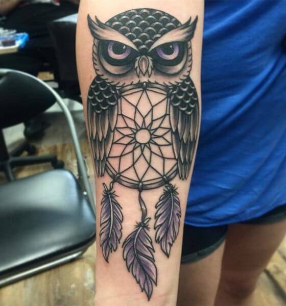 Dream catcher tattoo with owl on forearm