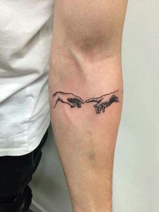 Small Hand Finger tattoo on forearm