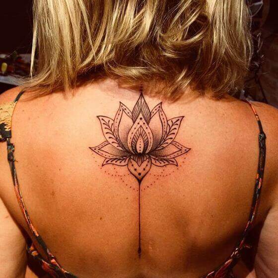 cute lotus flower tattoo on female back