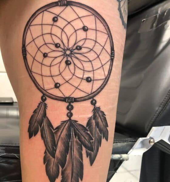 dream catcher tattoo on thigh