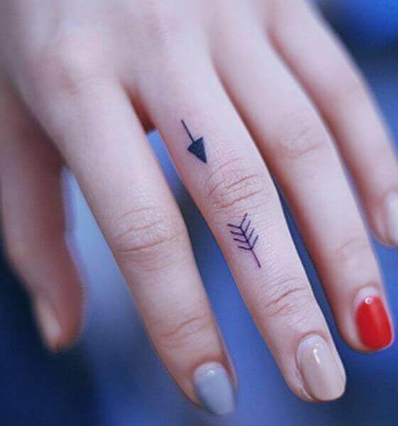 Arrow tattoo on finger
