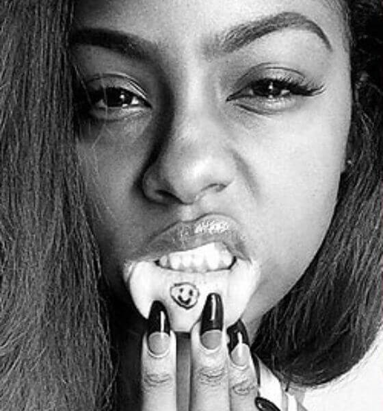 Justine Skye has the Smiley symbol etched on her inner lips