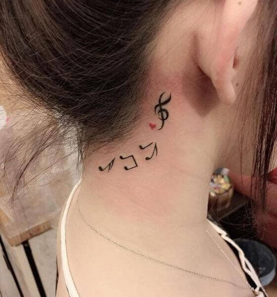 Music Symbol Tattoo on behind the women ear tattoo