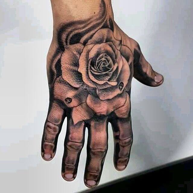 Rose skeleton hand tattoo